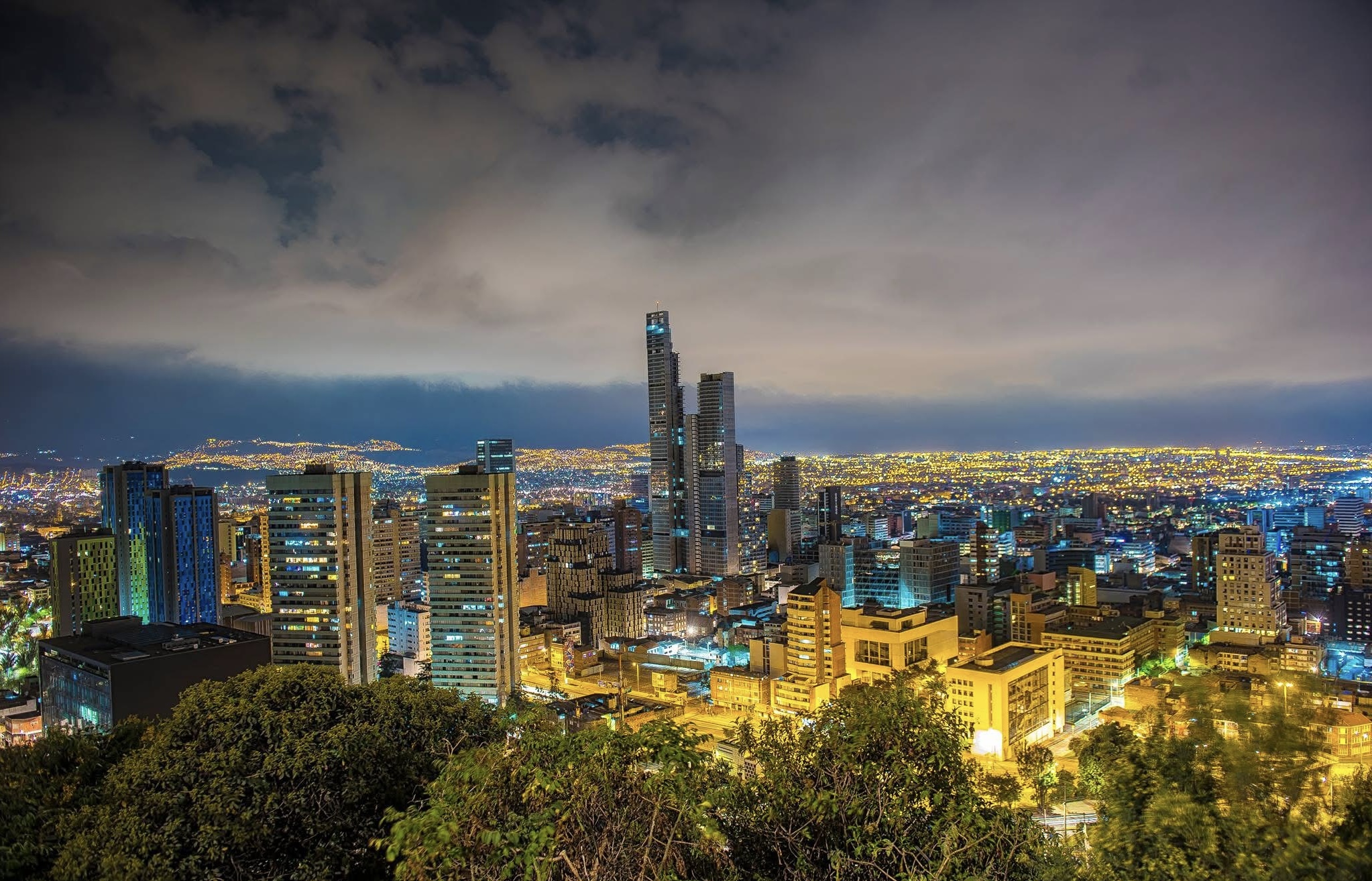 Cityscape of downtown Bogotá at night, highlighting Colombia’s modern skyline and vibrant urban life